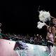 Police personnel watch cheerleaders during an Indian Premier League cricket match.